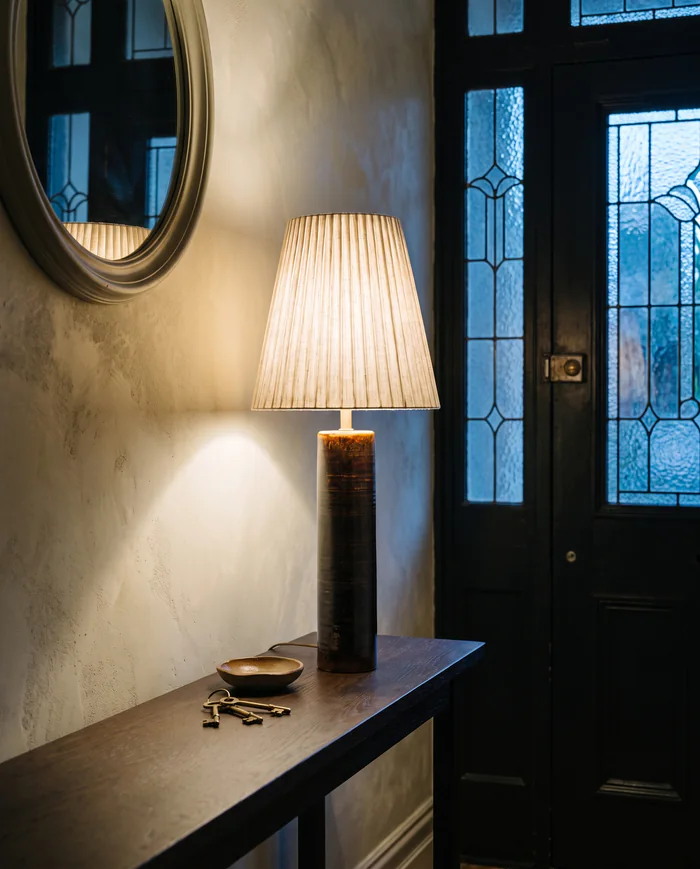 Column lamp: in a hall at dusk