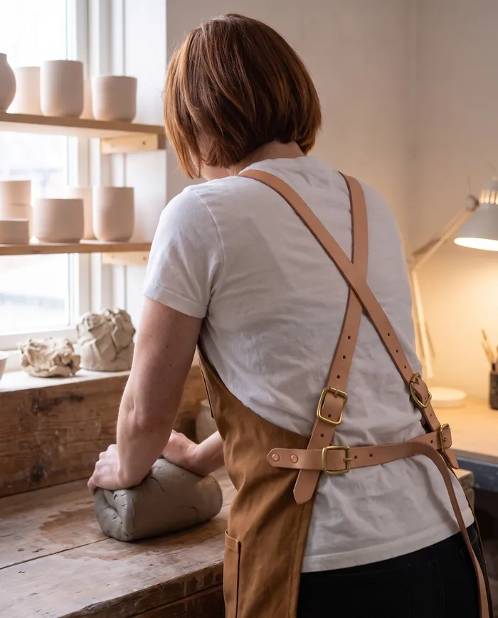 Merewether shop apron: cross-back straps, no weight on the neck