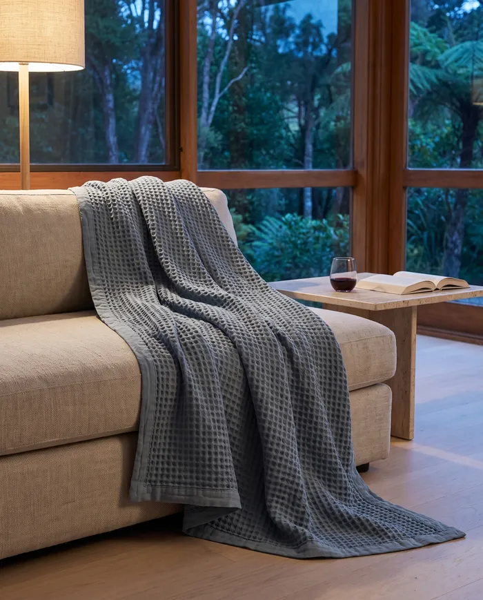 Linen waffle blanket: the throw, on the sofa at dusk
