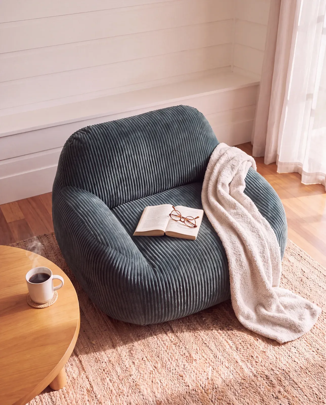 Reading corner, book and throw